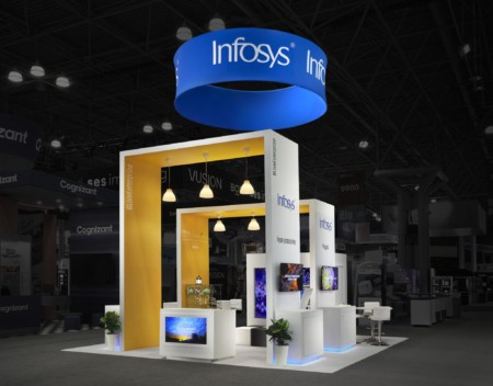 Infosys exhibit with hanging sign and large arches and hanging lights